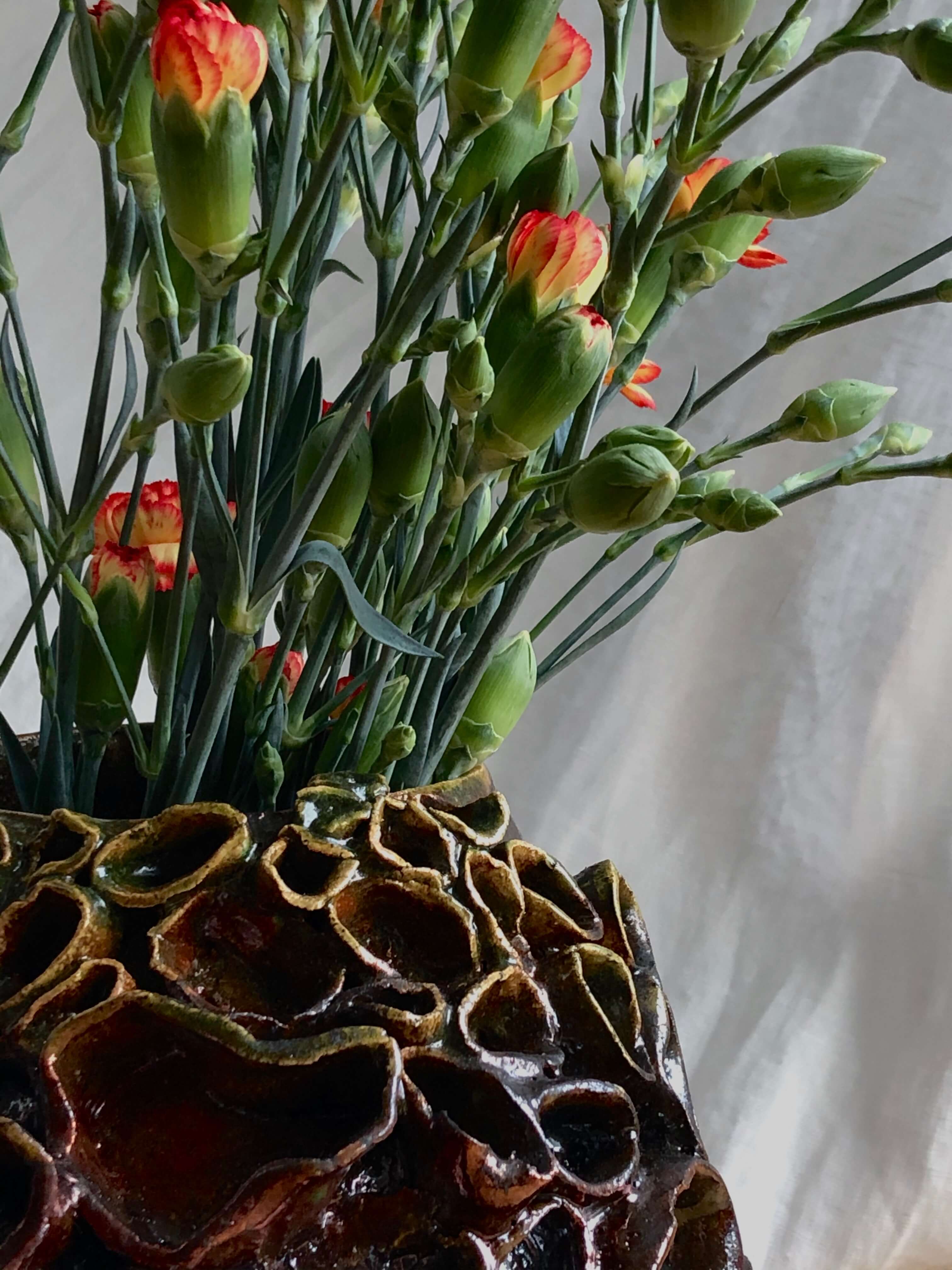 ceramic flower vase, candle holder and a bowl, made in japanese raku technique